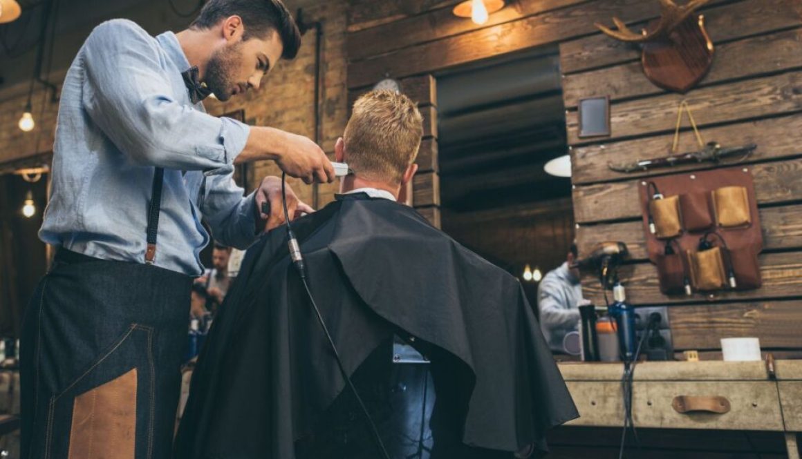 The man wants to have a middle-part hairstyle.