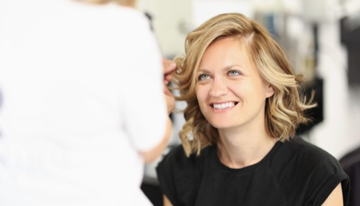The woman is excited to have bronde hair.