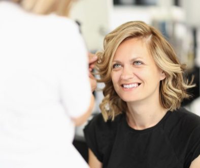 The woman is excited to have bronde hair.
